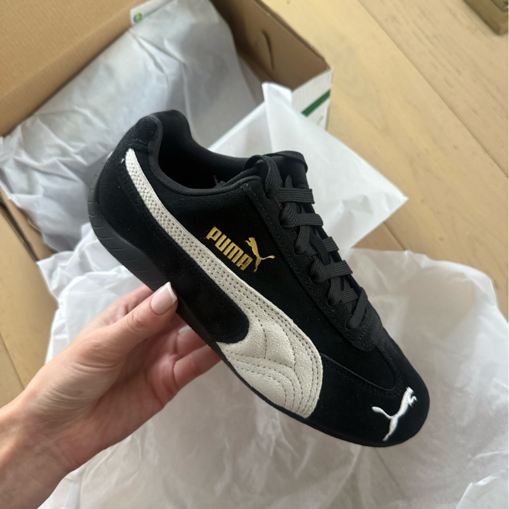 Puma Black and White Sneakers with Gold Accent